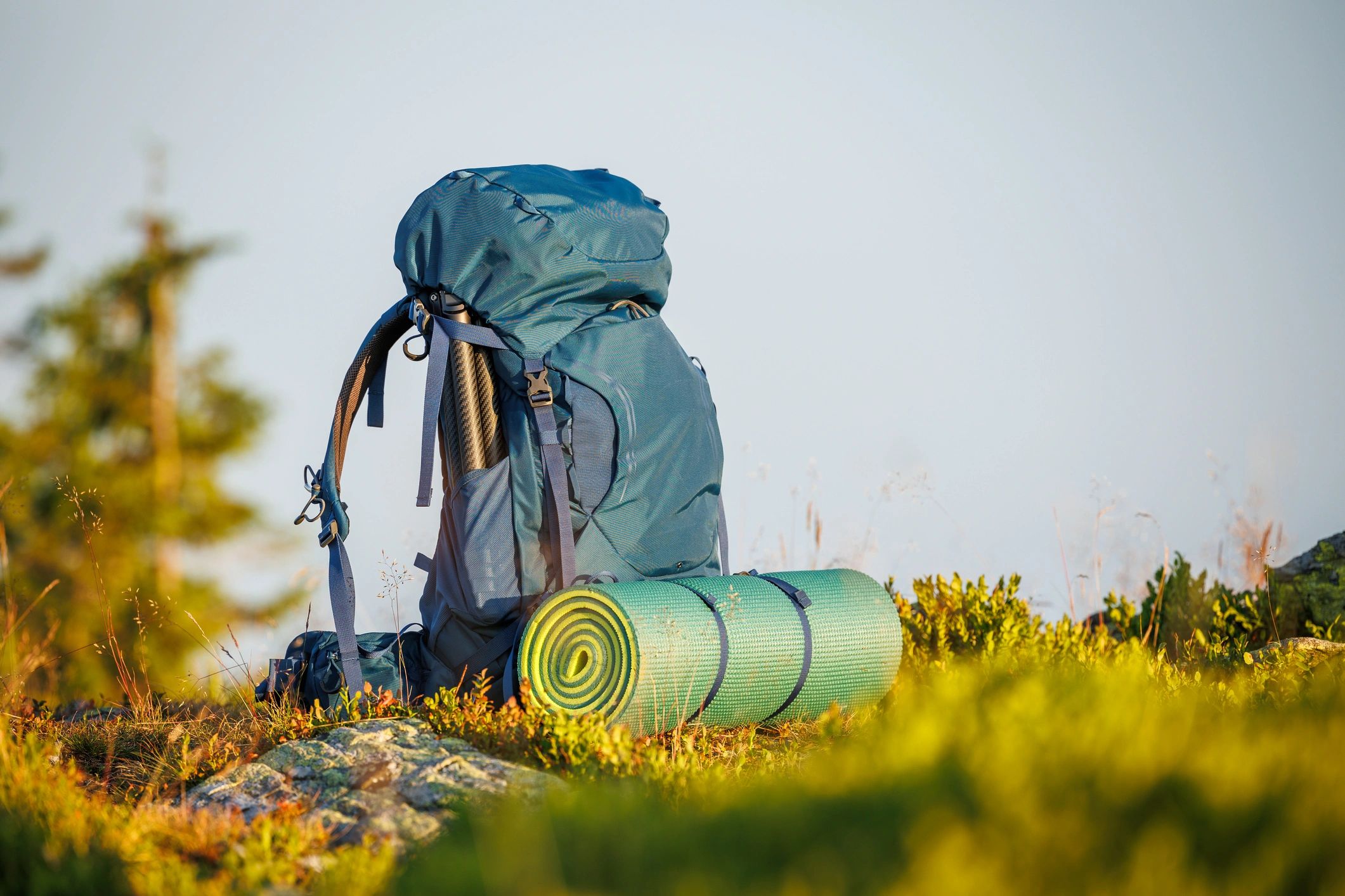 Hiking backpack and trekking equipment in the mountains