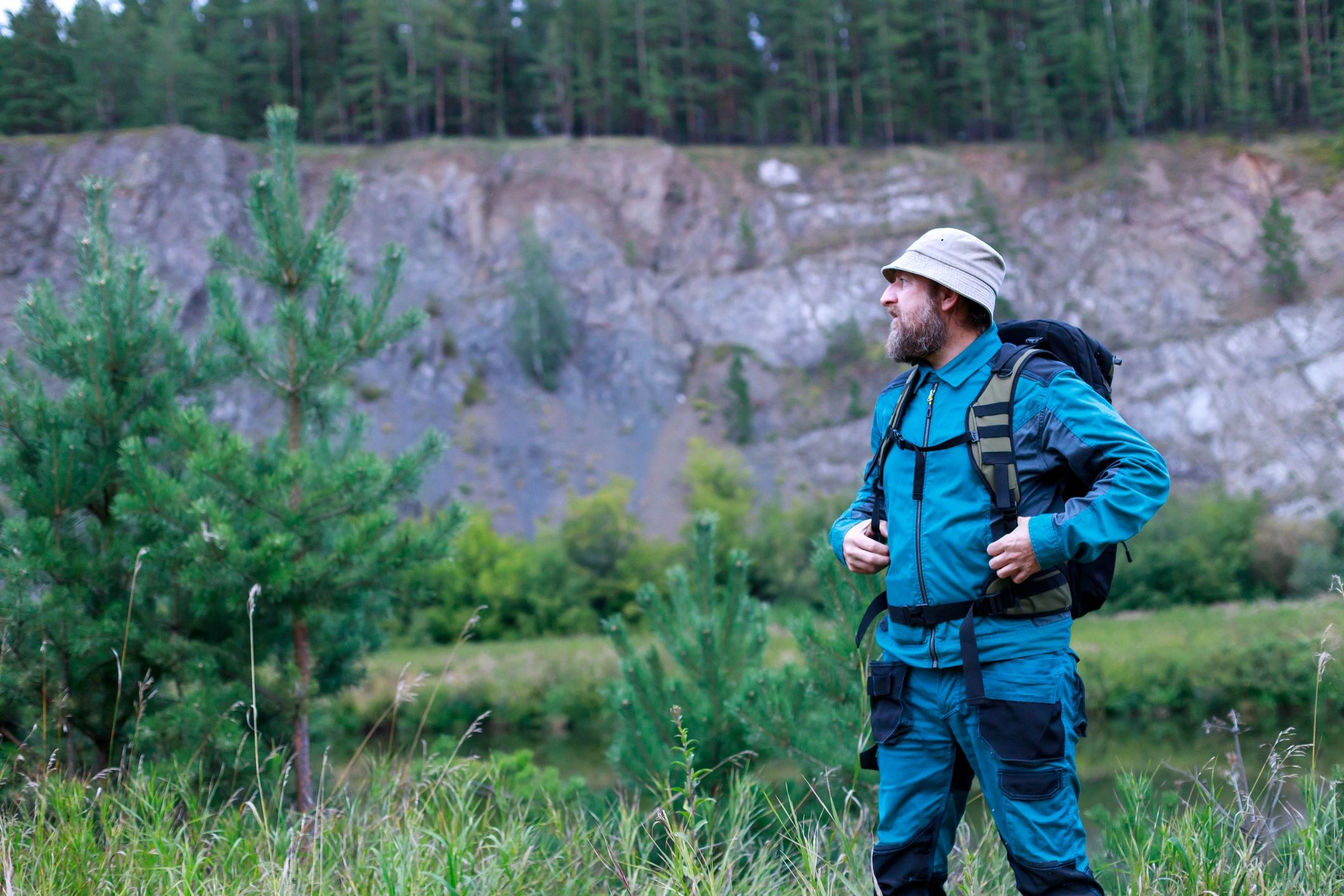 Hunter in mountain terrain looking into the distance