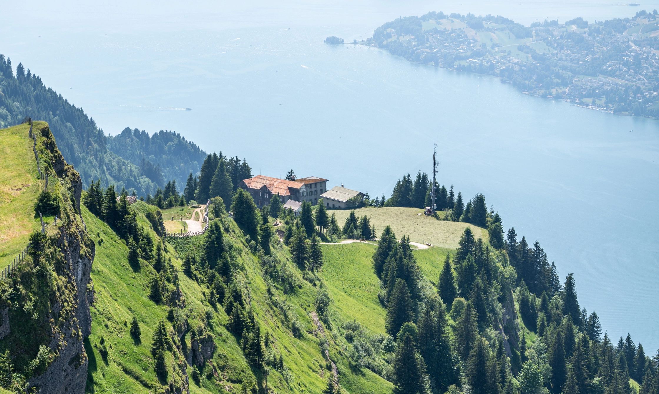 Alpine hiking trail above a mountain lake